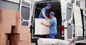 Millersport movers loading furniture into the back of a truck