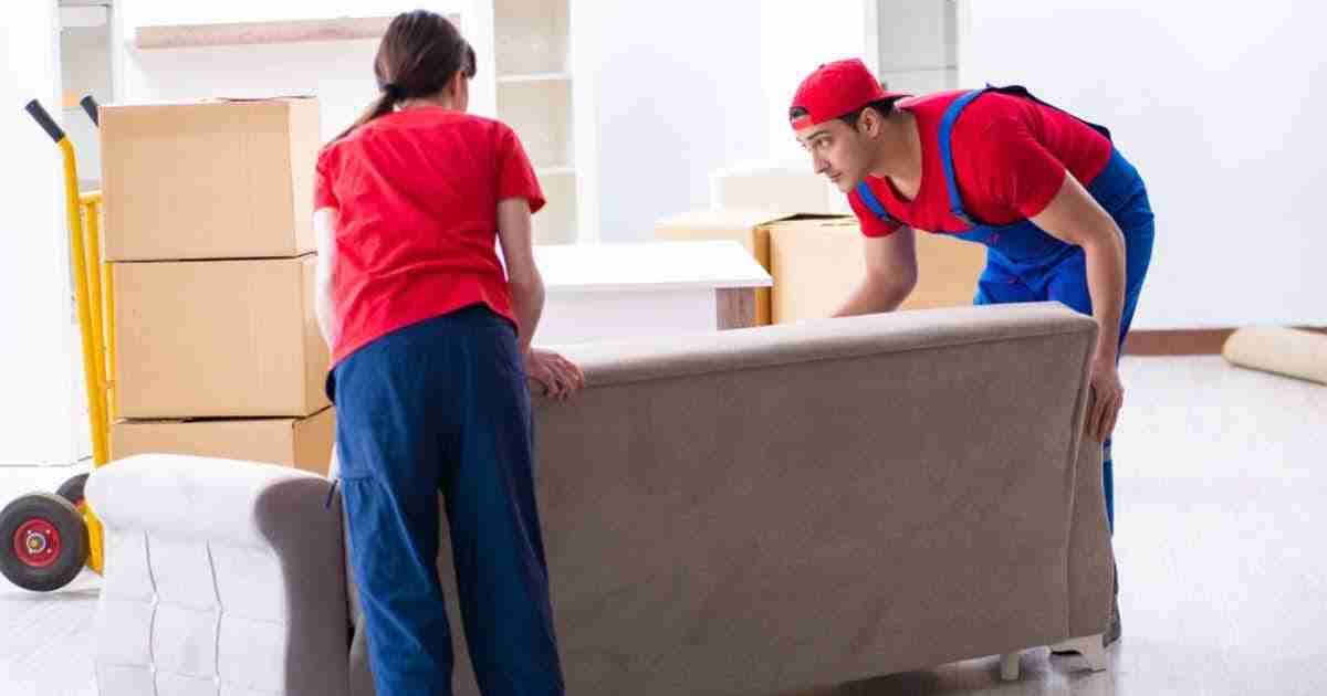 Two Obetz OH movers handling a couch in a home