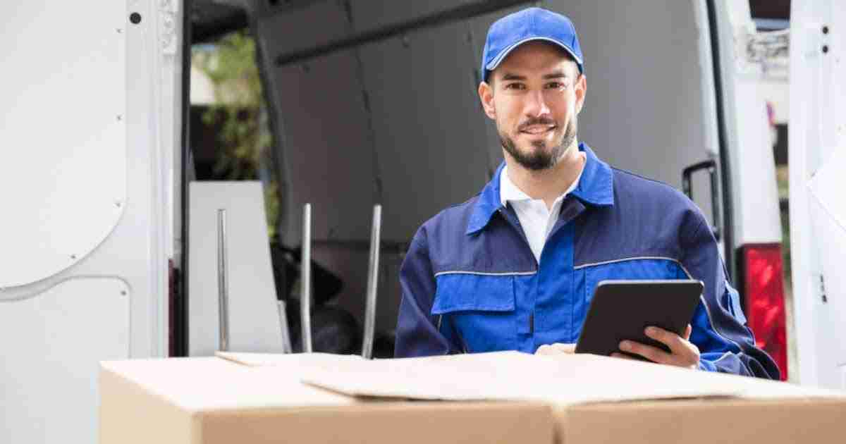 A mover from an Obetz moving company checking a tablet 