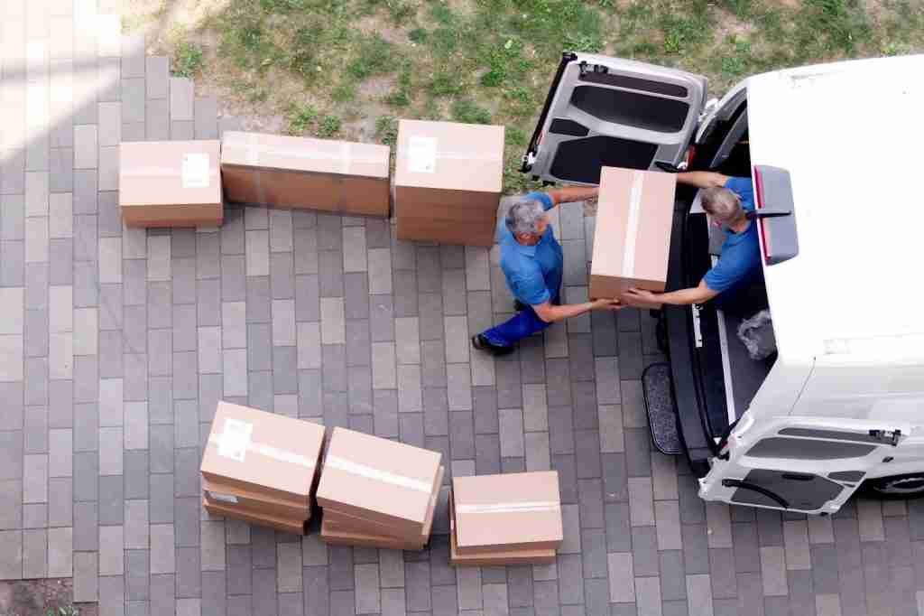 aerial shot of two Columbus movers loading boxes into a moving van